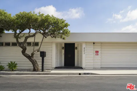 a view of a house with a tree