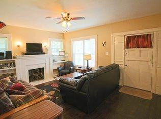 1910 16th Street Lubbock, TX 79401 - Photo 20 of 21 a living room with furniture a fireplace and a flat screen tv