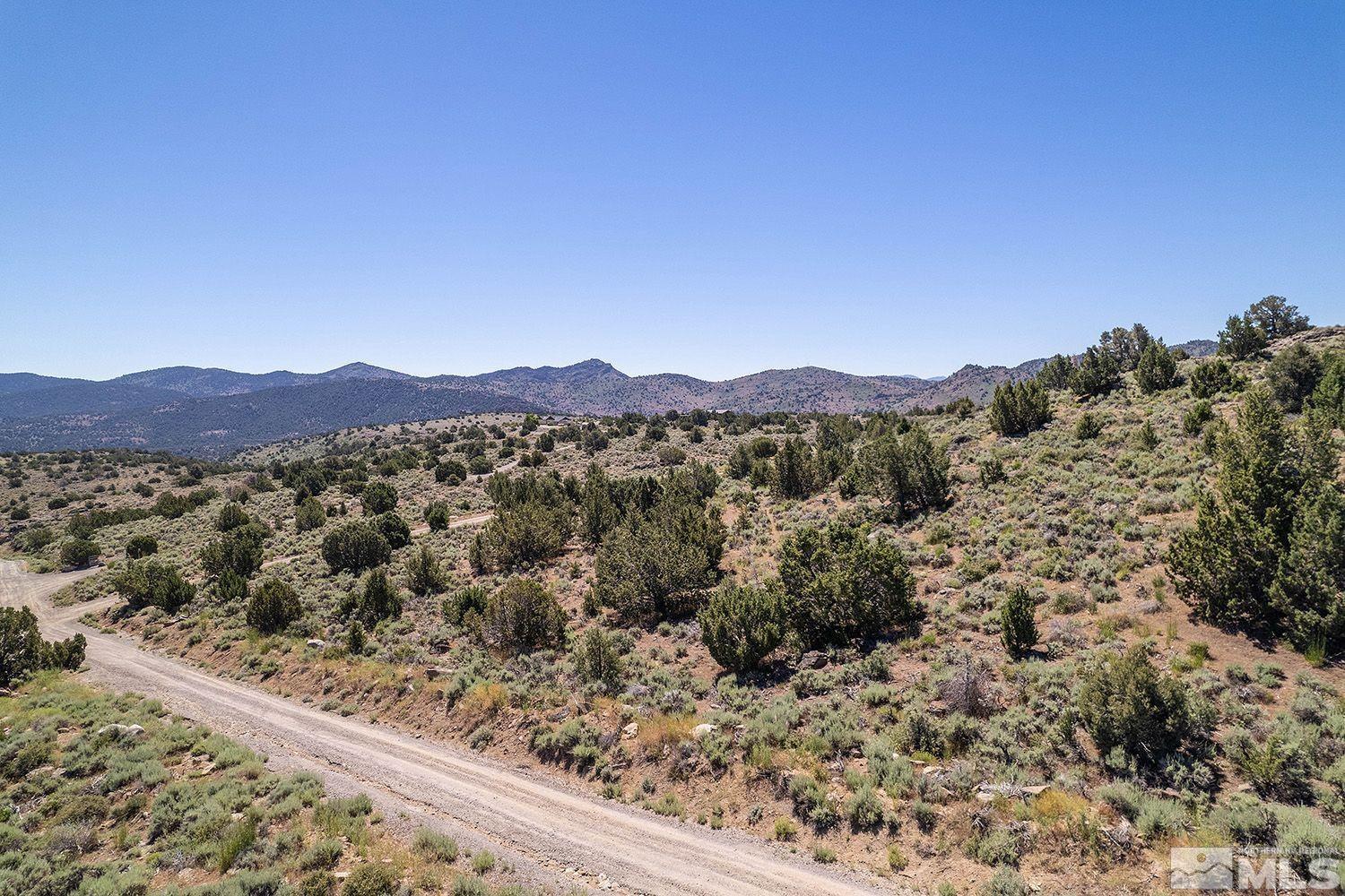 4350 Rocky Road, Unit 435 Reno, NV 89521 - Photo 1 of 8 a view of a mountain range with trees in the background