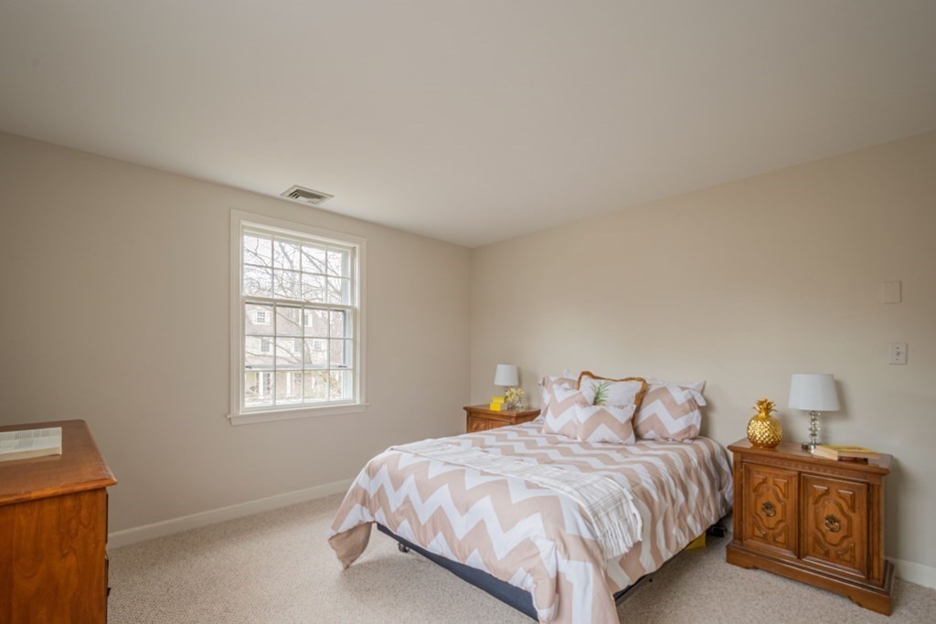 11 Nickerson Road Lexington, MA 02421 - Photo 27 of 42 a bedroom with a bed and window