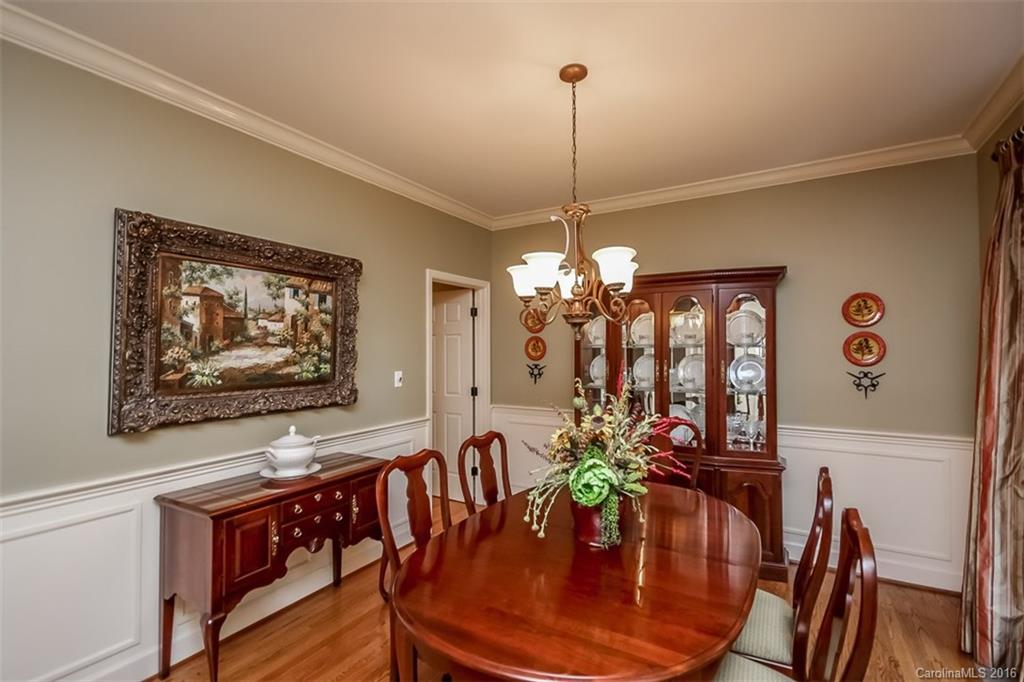 4567 Kiser Island Road Terrell, NC 28682 - Photo 6 of 24 a view of a dining room with furniture wooden floor and chandelier