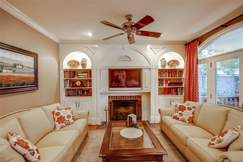 4567 Kiser Island Road Terrell, NC 28682 - Photo 7 of 24 a living room with furniture a fireplace and a flat screen tv