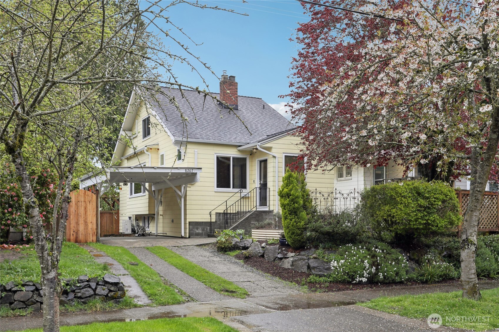 8207 Meridian Avenue North Seattle, WA 98103 - Photo 1 of 34 a front view of a house with a garden and plants