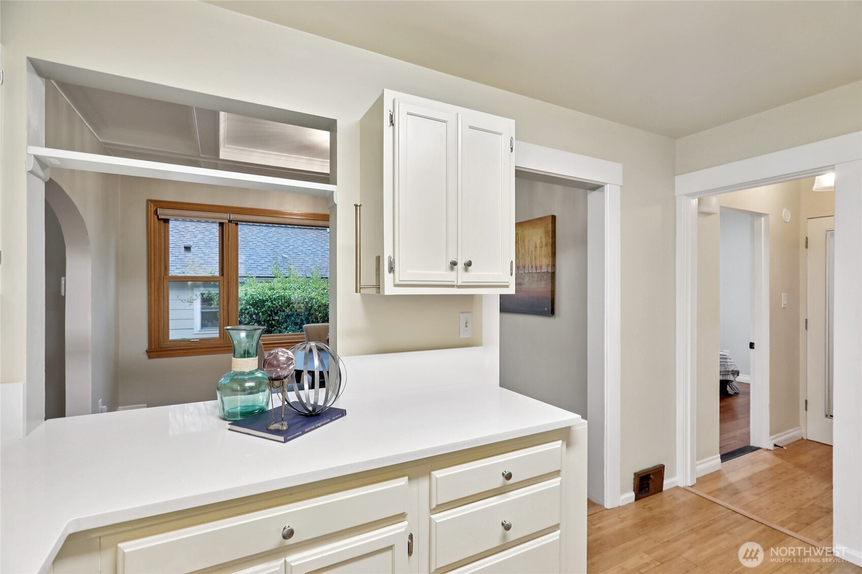 8207 Meridian Avenue North Seattle, WA 98103 - Photo 14 of 34 a kitchen with a wooden floor and cabinets