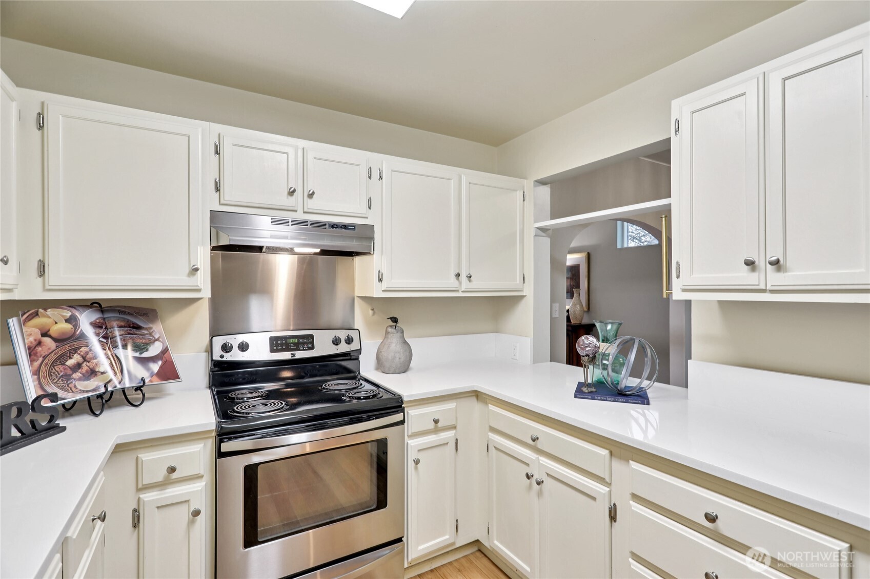 8207 Meridian Avenue North Seattle, WA 98103 - Photo 15 of 34 a kitchen with stainless steel appliances white cabinets and a stove a refrigerator a sink