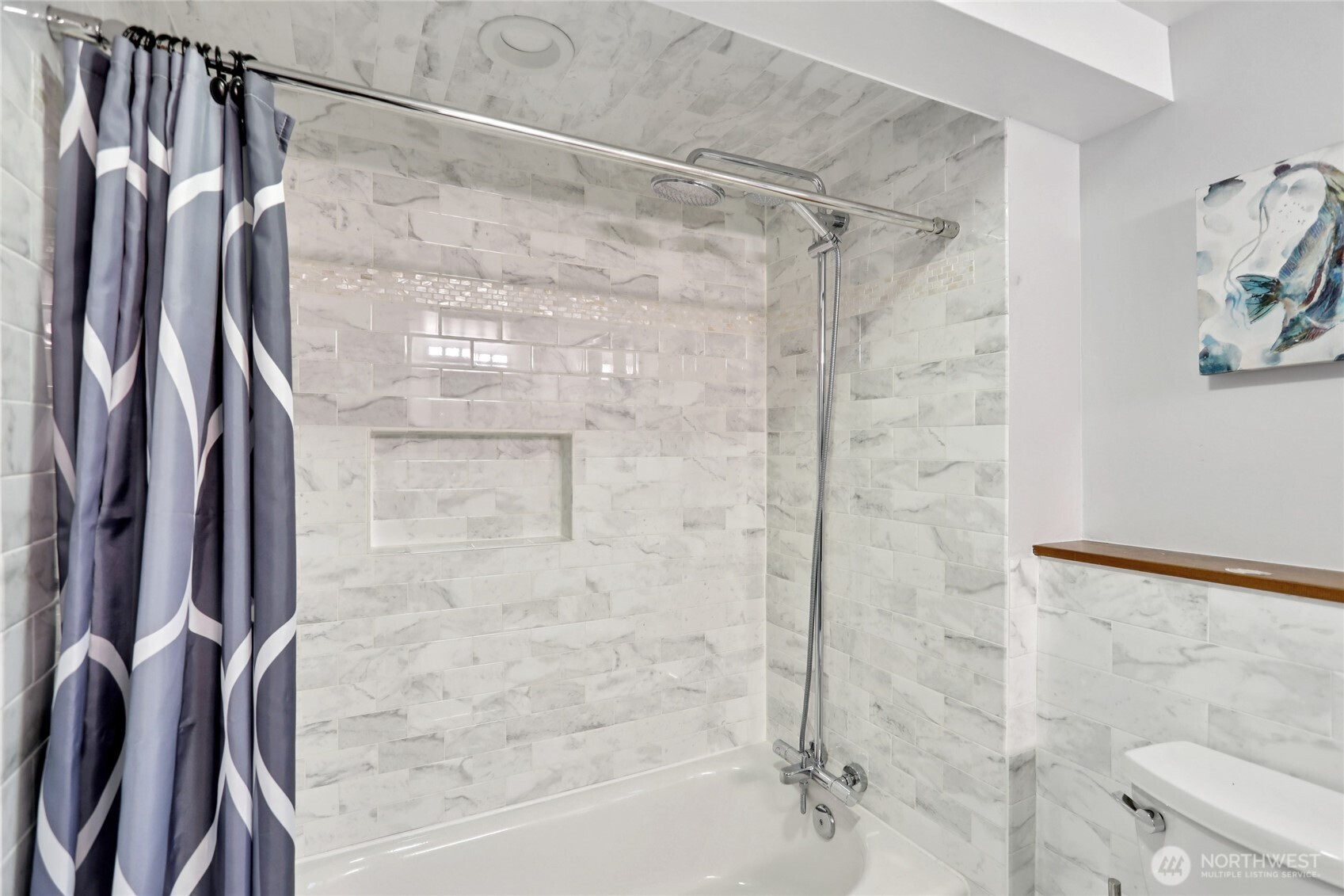 8207 Meridian Avenue North Seattle, WA 98103 - Photo 17 of 34 a bathroom with a shower and a glass door shower