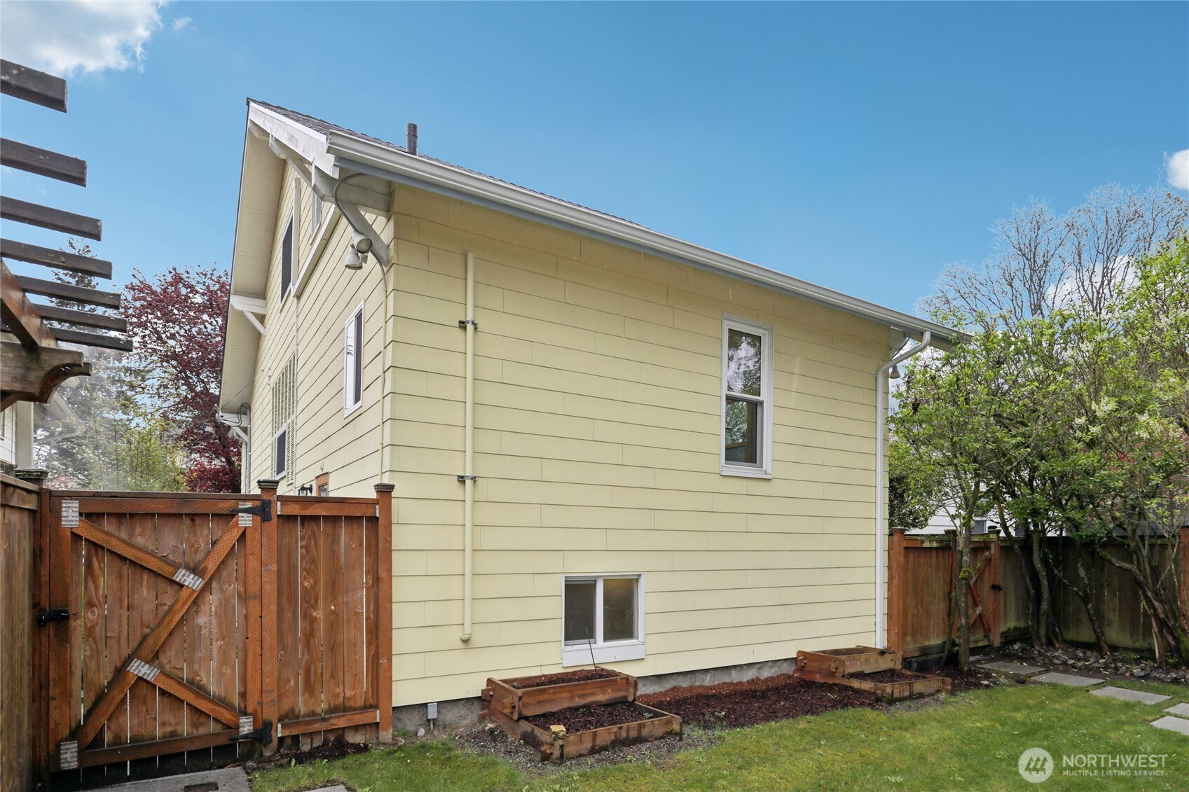 8207 Meridian Avenue North Seattle, WA 98103 - Photo 31 of 34 a front view of a house with a yard