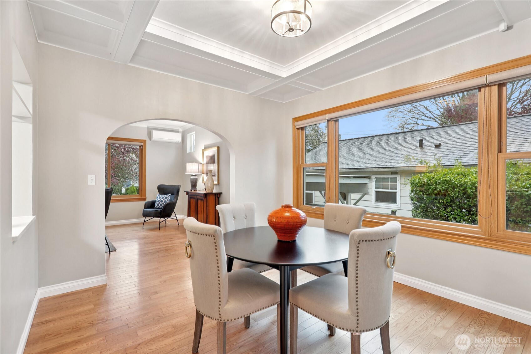 8207 Meridian Avenue North Seattle, WA 98103 - Photo 10 of 34 a view of a dining room with furniture window and wooden floor