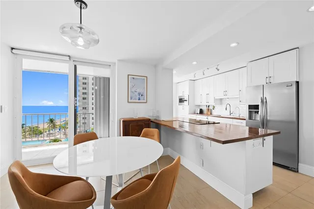 a very nice looking dining room with a table and chairs