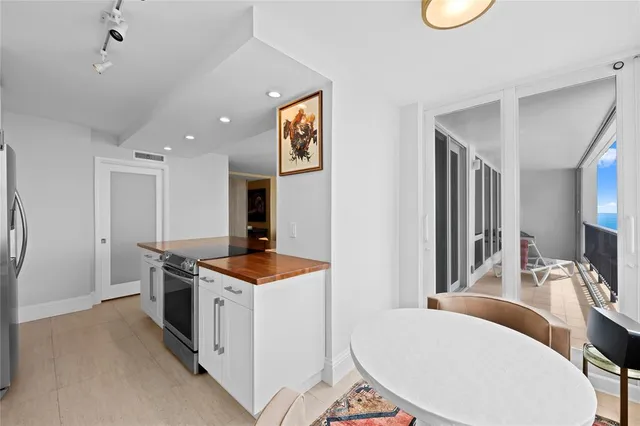 a view of a bedroom with furniture wooden floor and window