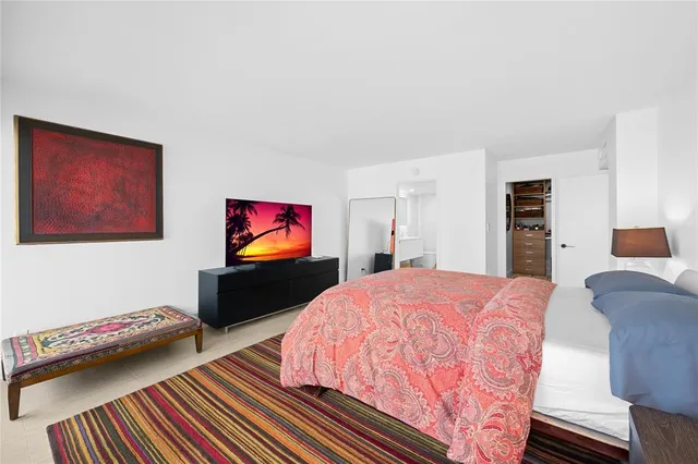 a bathroom with a sink a toilet a shower and a mirror