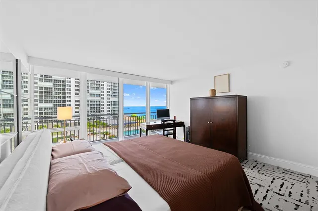 a bedroom with a bed and a table in it