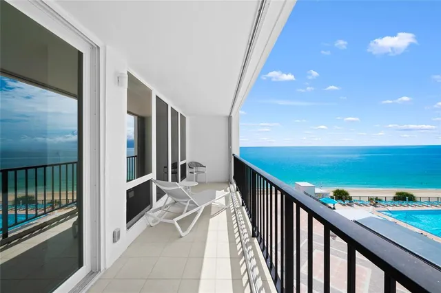 a terrace with a table and chairs