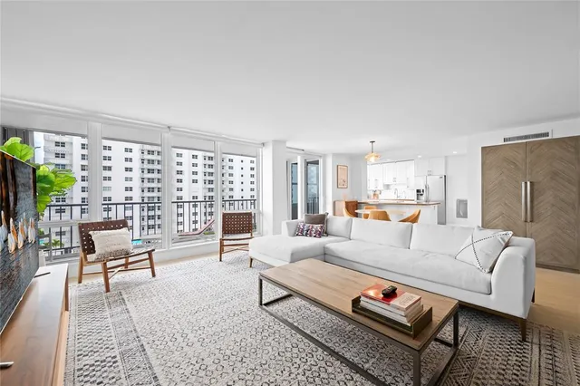 a kitchen with granite countertop a refrigerator and a sink