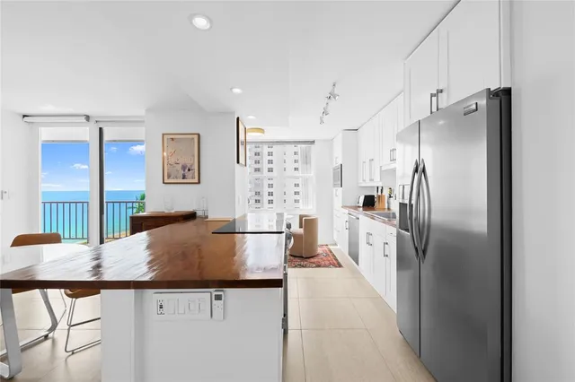 a view of an entryway with wooden floor and windows