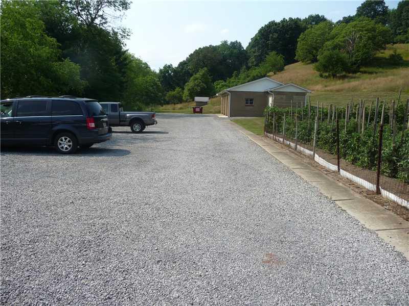 393 Kaufman Road Tarentum, PA 15084 - Photo 8 of 23 Other. View of parking lot going towards back of the property and the detached 4 door garage w/2 storage units