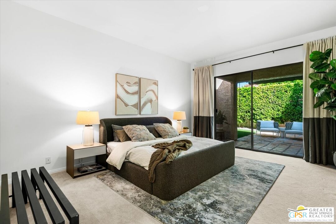 55 Sierra Madre Street Rancho Mirage, CA 92270 - Photo 18 of 59 a bedroom with a large bed and a large window
