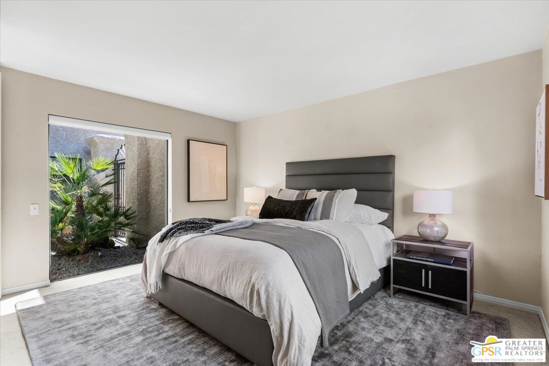 55 Sierra Madre Street Rancho Mirage, CA 92270 - Photo 26 of 59 a bedroom with a bed lamp and a potted plant
