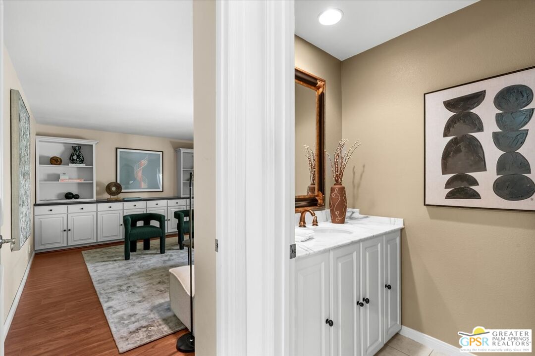 55 Sierra Madre Street Rancho Mirage, CA 92270 - Photo 30 of 59 a en suite bathroom with a sink double vanity and a mirror