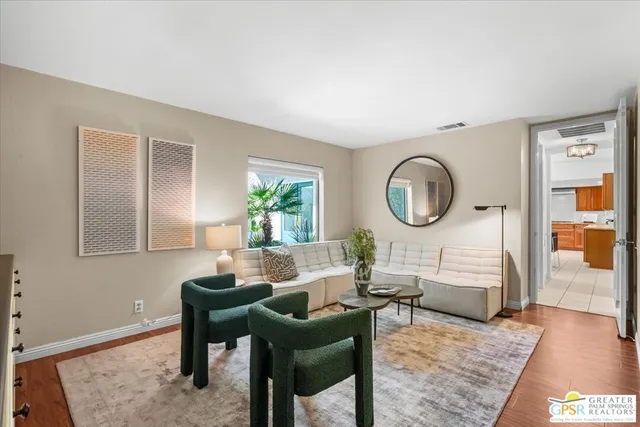 a view of backyard of house with yard patio and outdoor seating