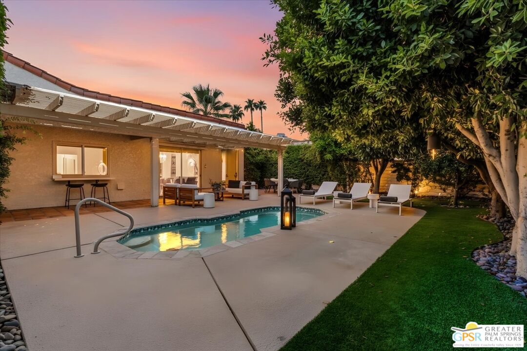 55 Sierra Madre Street Rancho Mirage, CA 92270 - Photo 37 of 59 a view of a patio with couches table and chairs and potted plants