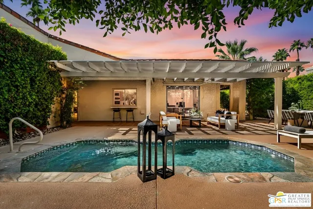 a outdoor living space with furniture and garden view