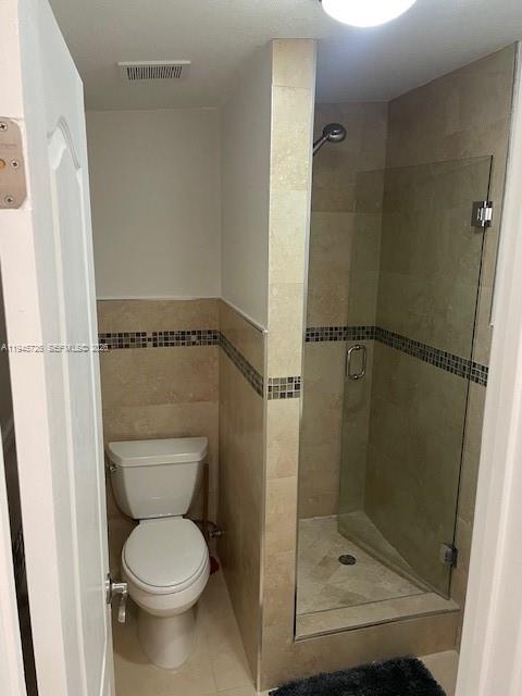 14983 Southwest 63rd Street Miami, FL 33193 - Photo 4 of 8 a bathroom with a toilet and a shower