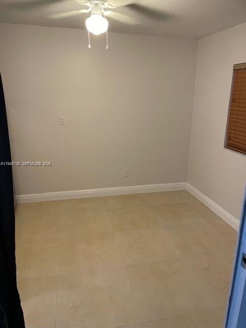 14983 Southwest 63rd Street Miami, FL 33193 - Photo 6 of 8 a view of a room with racks on the wall