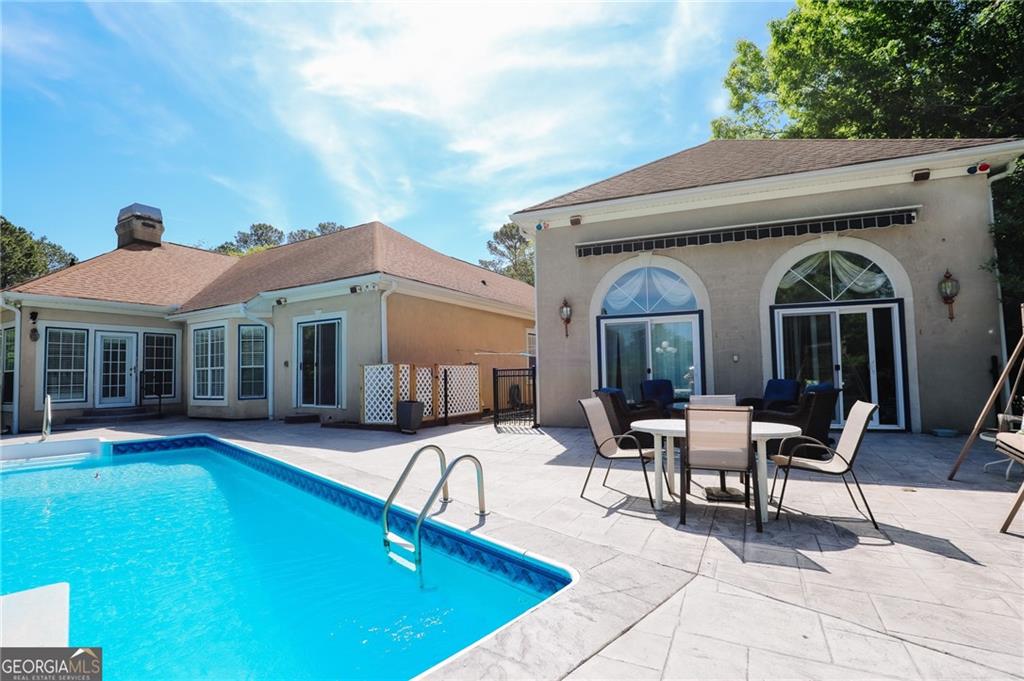 7404 Golfers Villa Rica, GA 30180 - Photo 35 of 43 a view of a house with swimming pool and sitting area