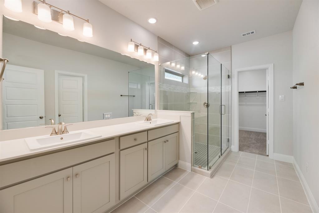 7009 Sunset Boulevard Rowlett, TX 75088 - Photo 23 of 35 a bathroom with a double vanity sink mirror and double