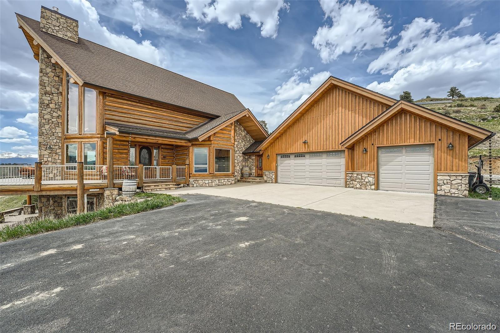 401 Raptor Point Golden, CO 80403 - Photo 22 of 40 a front view of a house with a garage