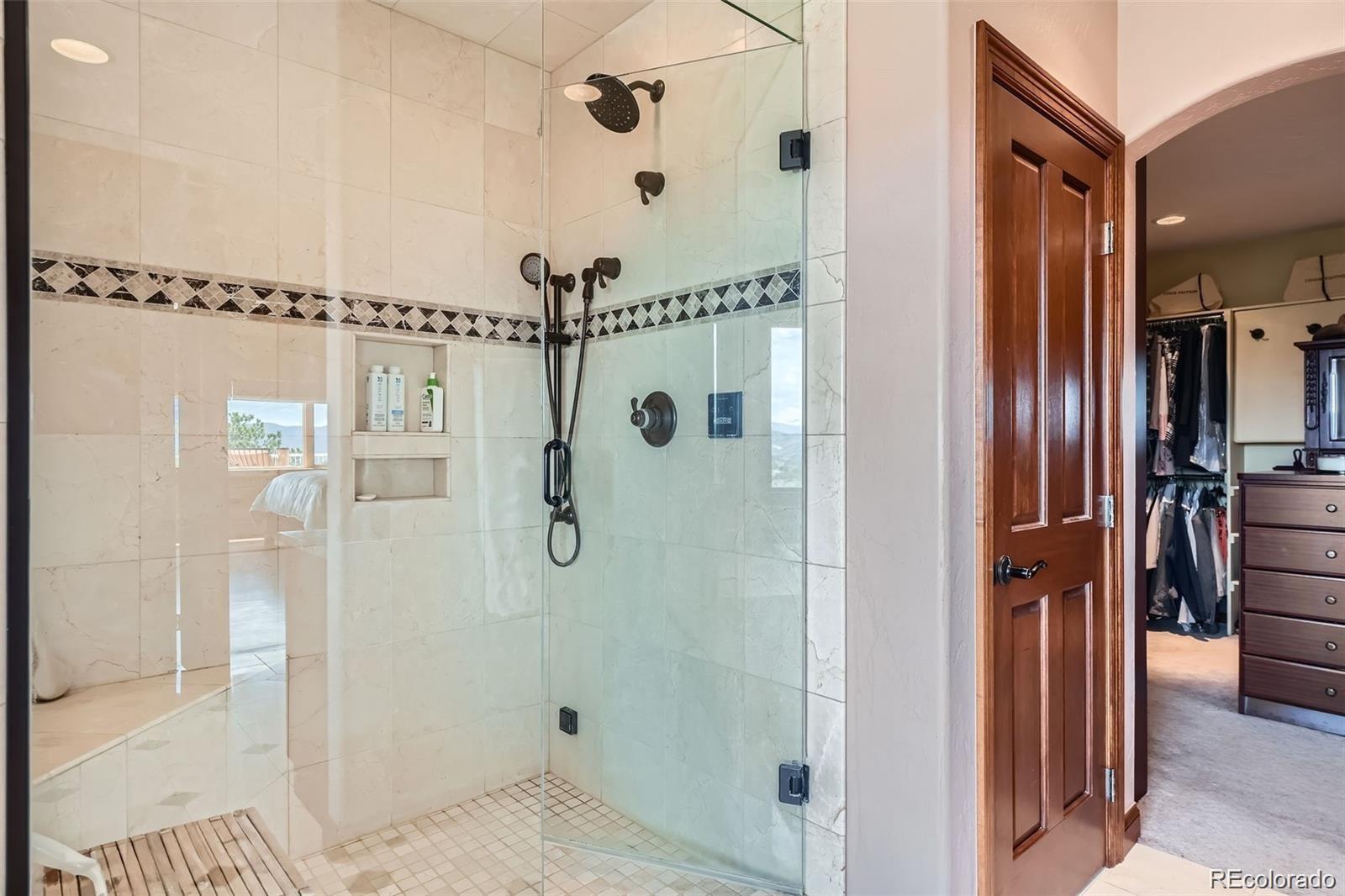 401 Raptor Point Golden, CO 80403 - Photo 28 of 40 a bathroom with a shower