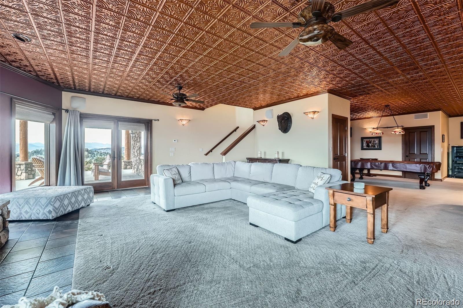401 Raptor Point Golden, CO 80403 - Photo 33 of 40 a living room with furniture and a large window