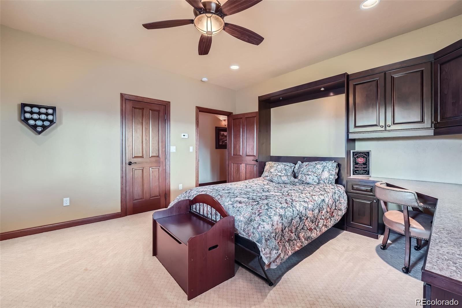 401 Raptor Point Golden, CO 80403 - Photo 35 of 40 a living room with a bed and furniture