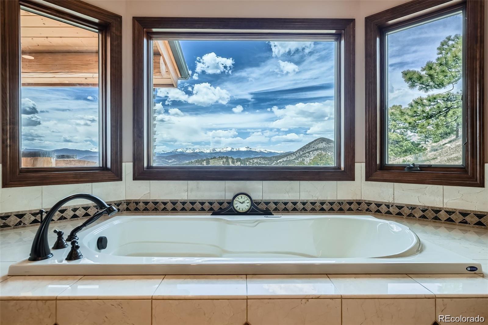 401 Raptor Point Golden, CO 80403 - Photo 4 of 40 a view of a bath tub sitting next to a window