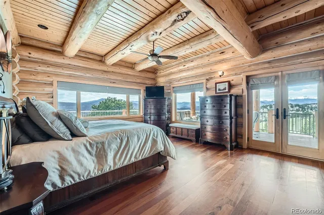 a building outdoor space with patio furniture and garden view