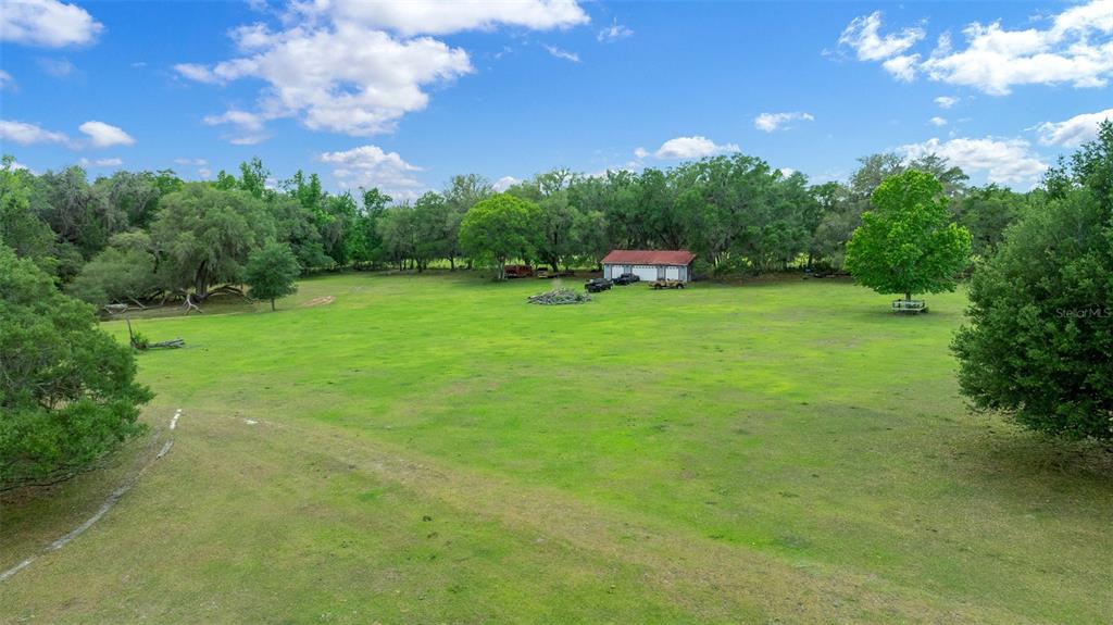 732 Carl Wilson Road Fort White, FL 32038 - Photo 53 of 80 a view of a big yard with a house in the background
