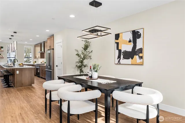 a view of a dining room with furniture and wooden floor