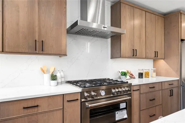 a kitchen with a stove and cabinets