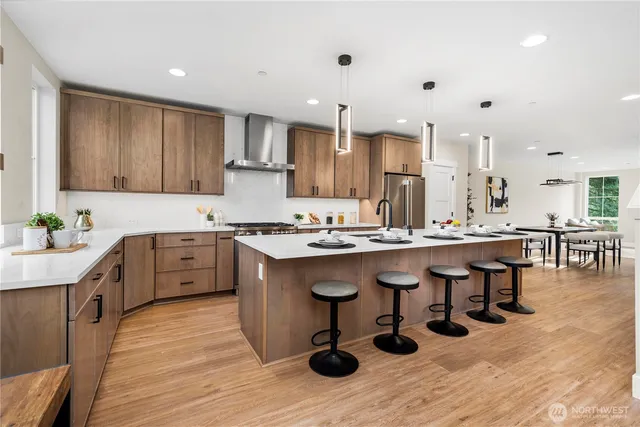 a kitchen with granite countertop a sink appliances and cabinets