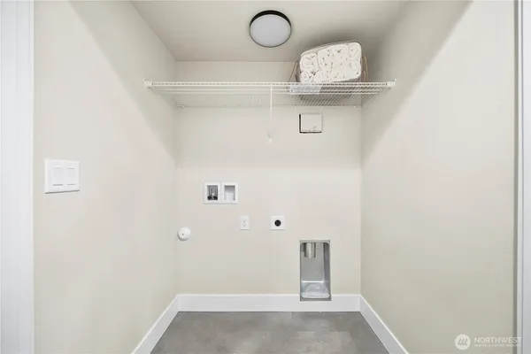 a view of a hallway with rack on the wall