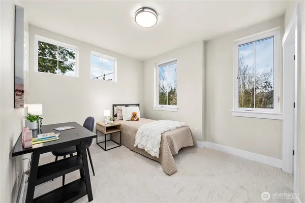 a bedroom with a bed and a table