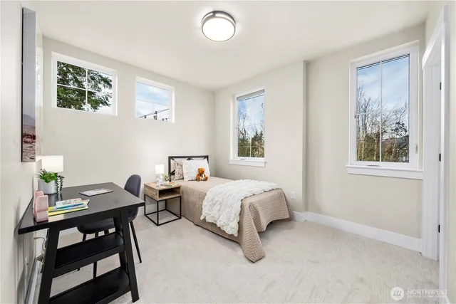 a bedroom with a bed and a table