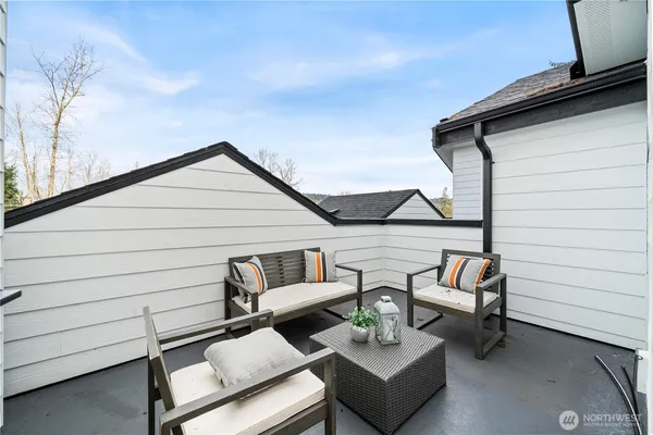 a view of a terrace with couches and pool table