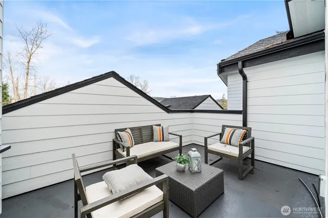 a view of a terrace with couches and pool table