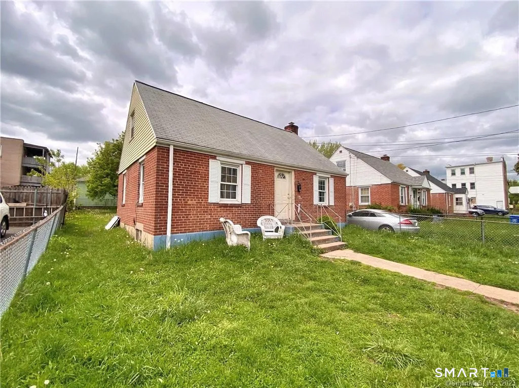 19 Baldwin Street Hartford, CT 06114 - Photo 2 of 4 a front view of house with yard and green space