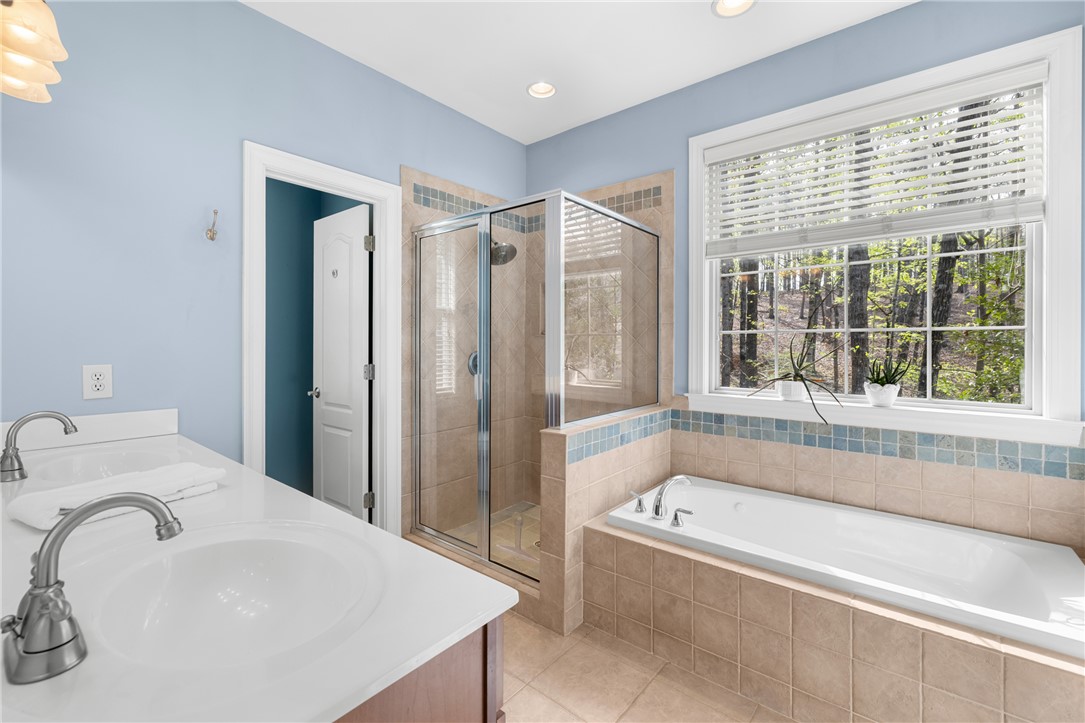 3 Halyard Way Salem, SC 29676 - Photo 17 of 48 This serene bathroom offers a spacious layout with dual vanities and a relaxing soaking tub.