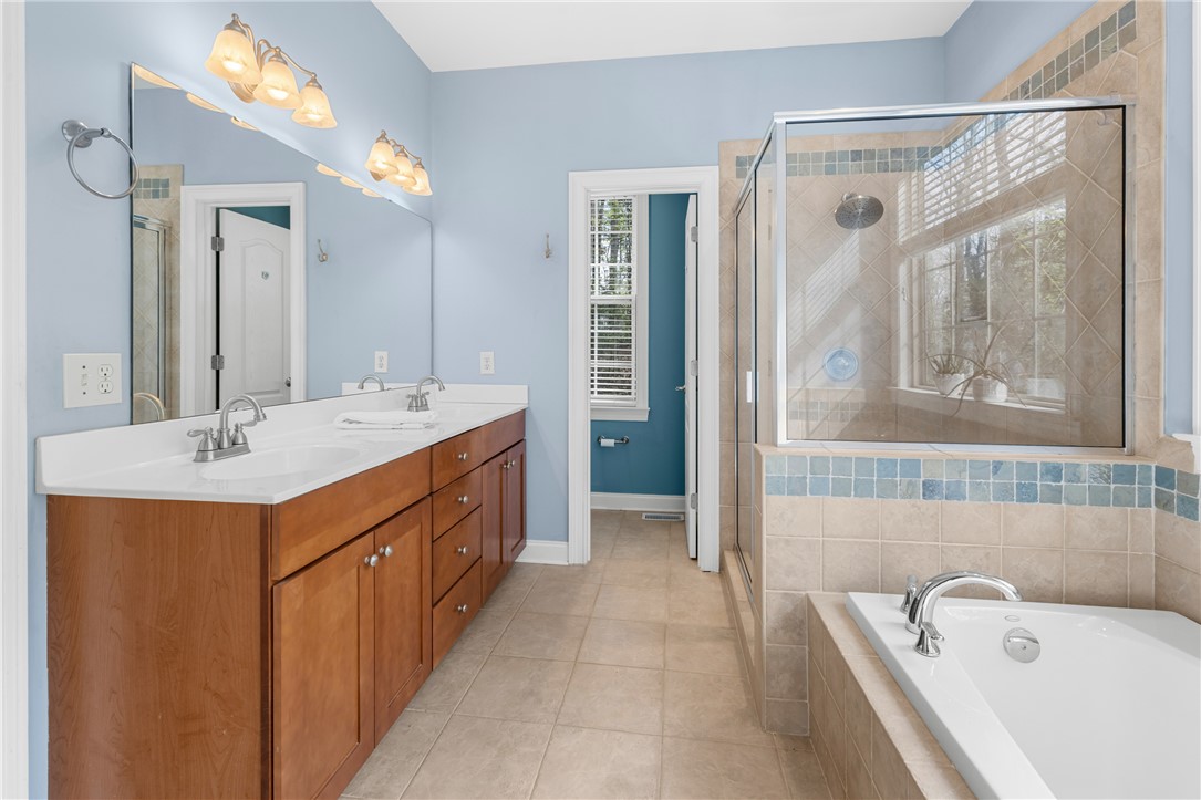 3 Halyard Way Salem, SC 29676 - Photo 19 of 48 This primary bathroom features a double vanity, a soaking tub, and a separate shower.