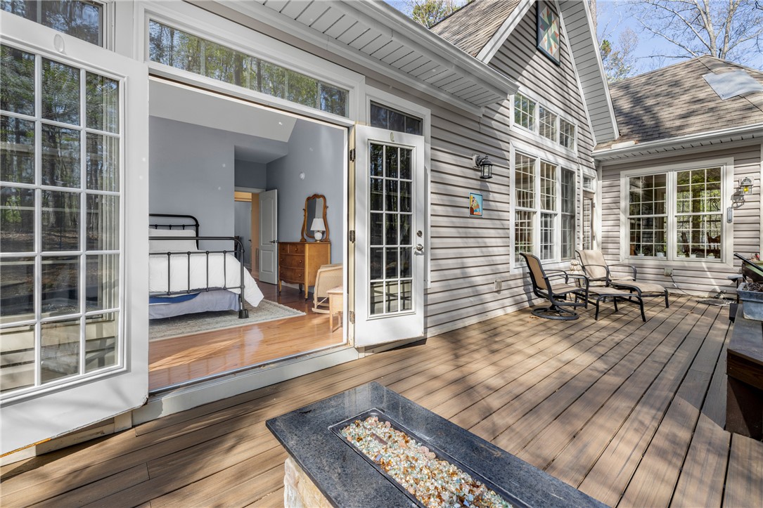 3 Halyard Way Salem, SC 29676 - Photo 21 of 48 This primary bedroom offers direct access to an inviting outdoor deck, blending comfort with nature.