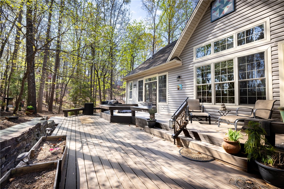 3 Halyard Way Salem, SC 29676 - Photo 23 of 48 An inviting outdoor living area seamlessly extends into a natural wooded landscape.